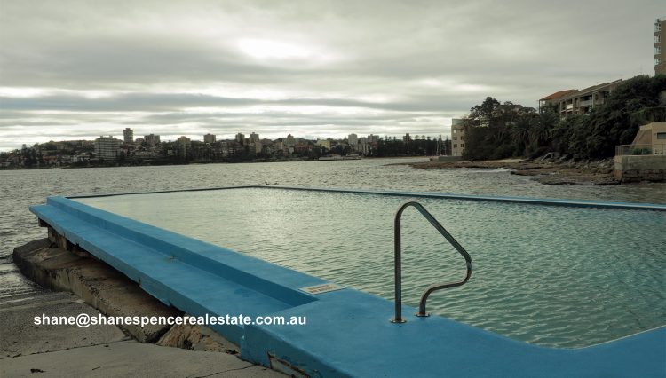 Sunset over the harbourside pool at The Moorings, 11 Addison Road, Manly
